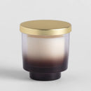 Béžová vonná sviečka.