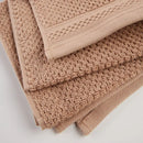 Béžový bavlnený uterák.