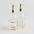 Dva zlaté dávkovače v oceľovom stojane.