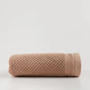 Béžový bavlnený uterák.