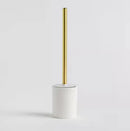 Biela WC kefa so zlatou rúčkou.