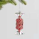 Červená vianočná ozdoba v podobe cukríka. 