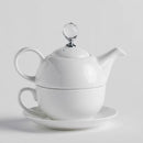 Biely porcelánový čajník so šálkou.