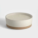 Béžová vonná sviečka.