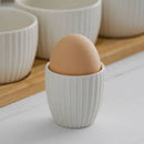 Biely stojan na vajíčko.