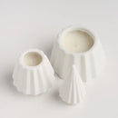 Biele vianočné sviečky v podobe stromčeka.