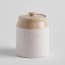 Béžová dóza s nápisom COFFEE.