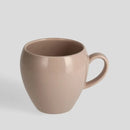 Ružový porcelánový hrnček.