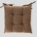 Béžový bavlnený podsedák.