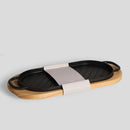 Čierno hnedá doska na servírovanie z liatiny a kaučukového dreva.