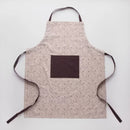 Béžová bavlnená zástera.