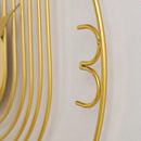 Zlaté kovové nástenné hodiny. 