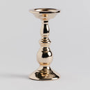 Zlatý kovový svietnik. 