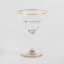 Transparentný sklenený pohár na koktajl so zlatým lemom.