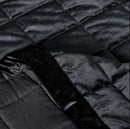 Čierny prehoz na posteľ