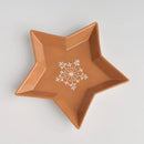 Hnedá vianočná misa z dolomitu v tvare hviezdy.