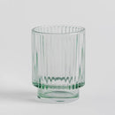 Zelený kúpeľňový pohár.