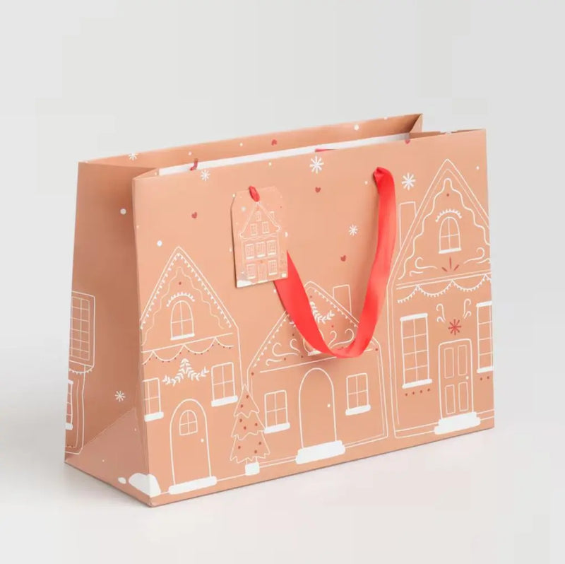 Hnedá vianočná papierová darčeková taška.