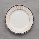 Bielo zlatý porcelánový plytký tanier.